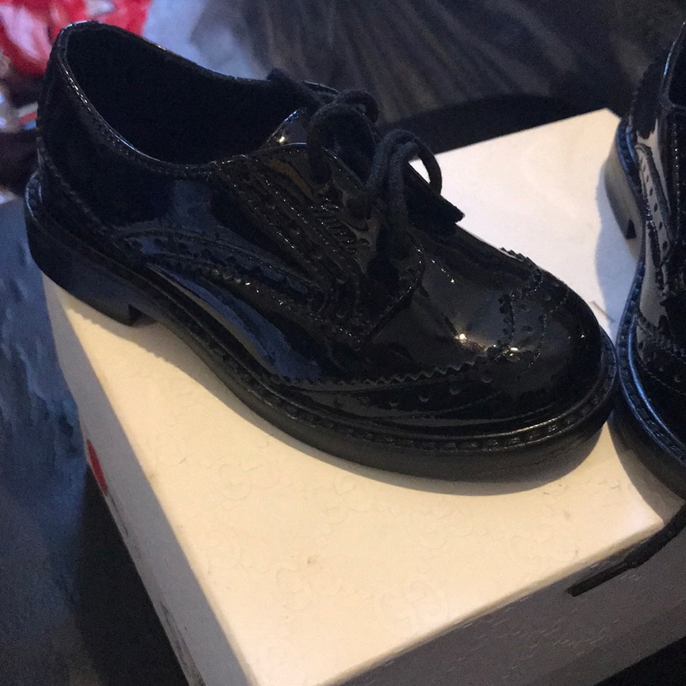 Authentic Gucci Black patent leather wingtip shoes